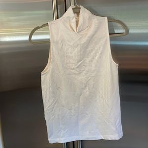 Athleta sleeveless mock turtleneck workout top.